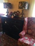 Two good-looking wing back chairs & black server; two of the several extra nice lamps