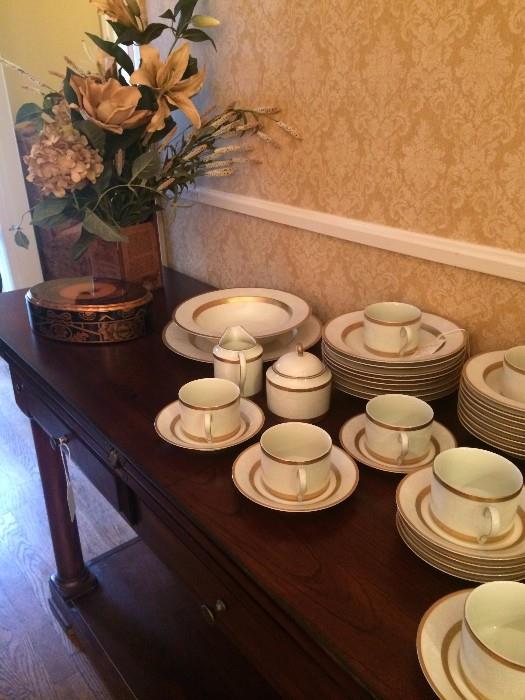 White and gold china and another server/sofa table