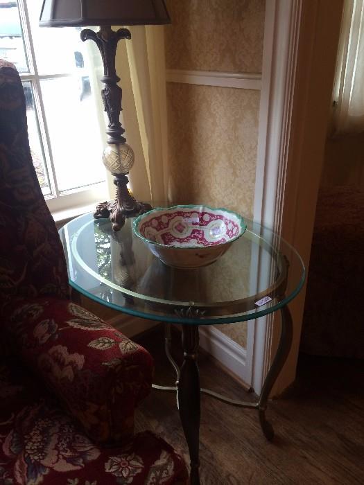 One of two matching oval glass top tables (has matching coffee table)