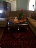 Good looking (great shape) sectional; large square black leather coffee table; black room divider