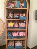 Some of the approx. 25 Madam Alexander dolls; rattan etegiere 