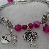 This pink handmade set is made by me of vintage silver plated forks, silver plated magnetic clasp, jump rings and charms. The beads are genuine pink striped agate and the bracelet will fit a 7 inch wrist. Earrings are sterling silver French wire with sterling filigree beads and pink striped agate beads.
Size: 7"