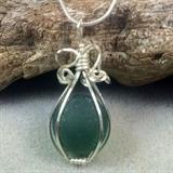 Hand Made Green English Sea Glass and Sterling Silver Pendant This lovely piece of frosty green sea glass is from England. It is wrapped in Argentium sterling silver wire and hangs from a silver plated chain.
Size: 