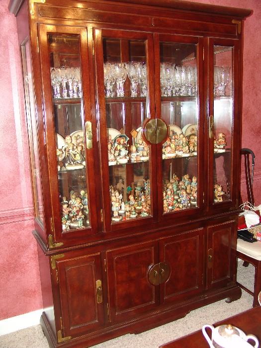 Mahogany breakfront filled with 1930 etched crystal and 60 Hummel figurines