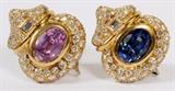 Lot#1045, AGL 10.75CT PINK & BLUE SAPPHIRES & 3.50CT DIAMOND EARRINGS, PAIR, L 1"A pair of AGL certified pink and blue oval cut sapphires centrally set amongst 120 pave set round brilliant cut and emerald cuts in 3.50ct total, with 18kt yellow gold backings.  AGL certified, report CS57780.  Weighing approximately 20.9 grams.