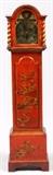 Lot#1090, ENGLISH CHINOISERIE GRANDMOTHER CLOCK, 19TH C., H 55"Width 13 3/4". Two key wind and two iron weights. Brass works. Brass pendulum. Brass dial with Roman numerals. Having red chinoiserie lacquer decorated case.  Dome shape hood which slides forward to remove. From the collection of Dr. Marion Scott and Ann Scott, Grosse Pointe Shores.