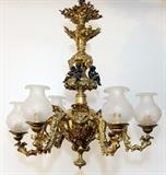 Lot#1113, FRENCH GILT METAL FIGURAL SIX-LIGHT CHANDELIER, H 25", DIA 28"Six light chandelier with frosted glass globes.