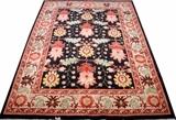 Lot#1120, HERIZ PERSIAN RUG, 10' 3" X 7' 3"Black ground with floral pattern overall.