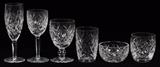 Lot#1169, WATERFORD 'AVOCA' & 'DONEGAL' CRYSTAL STEMWARE, 23 PIECES.Including 2 champagne flutes and 2 claret wines in the 'Avoca' pattern.  Along with 5 white wines, 2 water goblets, 8 old fashioned glasses, 2 flat tumblers, and 2 finger bowls in the 'Donegal' pattern.  All are marked at the undersides.