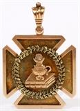 Lot#1232, ANTIQUE 10KT GOLD & DIAMOND GRADUATION PENDANT, 1894, L 1 7/8" X 1 3/8"Inscribed at the back 'Baltimore College of Dental Surgery First Honor, Class of 1894'.  From the Baltimore College of Dental Surgery, now known as University of Maryland where the first dental school in the world was founded in 1840 and the Doctorate of Dental Surgery (D.D.S.) was started.  Decorated with Latin script and a stack of books at the front.  No apparent markings.  Weighing approximately 15.5 grams.