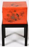 Lot#1291, JAPANESE RED LACQUER BOX, H 7", W 10", ON A SEPARATE STAND.A rectangular box with hinged lid, flanked by red handles, bird and branch motif on a red ground, raised on a separate black stand. From the collection of Dr. Marion Scott and Ann Scott, Grosse Pointe Shores.