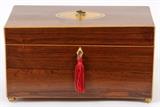 Lot#1329, ENGLISH ROSEWOOD & SATINWOOD TEA CADDY, 19TH C., H 6", L 12"Good patina to mahogany. Hinged cover. Satinwood inlay on cover in fan motif. Nice fitted interior with covers to two tea wells.  Measures H.6 1/2" x 12" x 6".