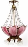 Lot#1354, AMERICAN SLAG GLASS FOUR-LIGHT CHANDELIER WITH PRISMS, EARLY 20TH C., H 27", DIA 17 1/2"Dark pink slag glass fixture comprising curved panels fitted with four light sockets within, an additional four lights below, each with a frosted glass shade in the form of a rose, hung with crystal prisms.