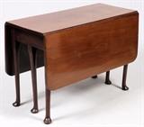 Lot#1359, QUEEN ANNE STYLE MAHOGANY DROP-LEAF TABLE, H 28", W 42", OPENS TO 51"Six legs, gate leg style. Center section is 17" plus two leaves at 17", thus opening to 51". From the collection of Dr. Marion Scott and Ann Scott, Grosse Pointe Shores.
