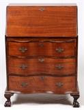Lot#1363, CHIPPENDALE STYLE MAHOGANY SLANT-FRONT DESK, H 40", W 28", D 16"Having three full-length drawers below a slant front which, when opened, reveals a writing surface, four pigeon compartments, three drawers and a central door that has a shell from design.  Key in consignor file.  Measures H.40" x 28 1/2" x 16".