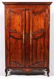 Lot#1368, COUNTRY FRENCH STYLE WALNUT ARMOIRE, H 81", W 48", D 23 1/2"With two carved doors opening onto one movable shelf and a hanging rod, raised on four supports.  No key.