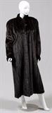 Lot#1394, KAY AMOS FURS, MINK FUR FULL LENGTH COAT, L 52"Labeled: Designed by Kay Amos Furs Grosse Pointe, Mich.  Having an interior sash, 1 upper exterior button closure, and 3 hook and eye closures at the front.  Monogrammed.