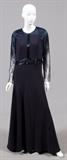 Lot#1398, ROMA SPOSA BEADED GOWN, SIZE 14.Dark blue evening gown with sheer sleeves and heavy beading on arms, back, and shoulders. No label: was custom made.