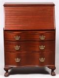 Lot#1536, CHIPPENDALE STYLE MAHOGANY SLANT-FRONT DESK, H 43", W 32", D 17"The Chippendale style desk has ball and claw feet, a slant front writing surface which, when open, reveals two drawers and five pigeon compartments all above three full length drawers.  Key included.