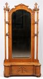 Lot#1537, AMERICAN OAK HALL BENCH, C. 1890, H 80", W 43", D 17"Having 6 mask form hooks, beveled mirror, carved acanthus leaf and bead details, and a bench opening to storage.  Measuring approximately H.80" x 43" x 17".
