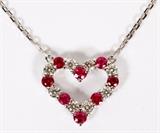 Lot#17, 0.60CT NATURAL RUBY & 0.42CT DIAMOND HEART FORM NECKLACE, L 16"A 0.60ct natural ruby alternating with 0.42ct diamond pattern heart form pendant, 5/8" W., fitted to a 14kt white gold chain.  The diamonds are G-color and VS-2 clarity.  Weighing approximately 3.4 grams.
