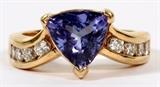 Lot#20, 1.00CT NATURAL BLUE TANZANITE & 0.50CT DIAMOND RING, SIZE 6 1/2.Featuring a 1.00ct natural blue brilliant cut blue tanzanite with 0.50ct side diamonds, all set in 14kt yellow gold.  The diamonds are G-color and VS-2 clarity.  Weighing approximately 6.1 grams.