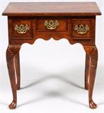 Lot#34, QUEEN ANNE STYLE BURL, YEW WOOD TABLE H 28", L 27", D 18"A three drawer, burl yew wood table with brass pulls. Queen Ann legs, 28 1/2" H. x 27" W. x 17 3/4" D.