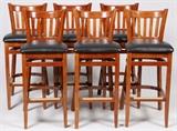 Lot#114, WOOD AND FAUX LEATHER BAR STOOLS, SIX, H 43",Six bar stools having fixed seats, of wood construction with brass foot rest guards and black faux leather seats.