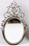 Lot#119, LABARGE WROUGHT IRON MIRROR, H 54", L 34"Having a wrought iron frame with scroll and leaf form designs, bevel glass.