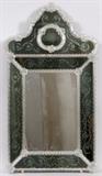Lot#118, VENETIAN GLASS MIRROR, H 42", L 22"A Venetian glass mirror with etching at each mitered panel at the edge and crest. Glass floral enhancements and spiral rope form borders.