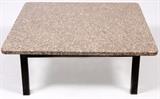 Lot#125, INDUSTRIAL STYLE METAL AND GRANITE COFFEE TABLE.Having a granite top with rounded corners, with a black metal frame with square legs.