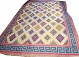Lot#132, INDIAN DHURRIE, HAND WOVEN, WOOL CARPET, W 10' 2", L 13' 4"Having a flat weave, beige ground, five borders with the primary border having a blue meander design flanked by two red and two brown guard borders. Field exhibits diamond designs with zig-zag accents in blue, red, yellow, brown and gray.