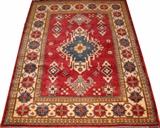 Lot#206, KAZAK WOOL RUG, W 4' 8", L 6' 2"Having three borders with the primary border in ivory and having spaced geometric medallions in red and blue. A red field with a central blue diamond shape medallion and accents in ivory, red and pale blue throughout.
