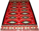 Lot#209, BESSARABIAN KILIM HAND WOVEN, WOOL RUG, W 5'3", L 8'having a red ground, one complete border of black saw tooth design, multiple borders at the ends with spaced diamond medallions in the field.