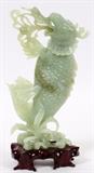 Lot#236, CHINESE CARVED SERPENTINE MYTHICAL FISH, H 8 1/4", W 4"Raised on a separate wood base.  Mid 20th century.