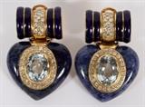 Lot#2062, DAVID WEBB 18KT YELLOW GOLD, SODALITE, TOPAZ & DIAMOND EARRINGS, PAIR..Two oval faceted topaz weighing approximately 4.2 carats each. Measurements of approximately 11mm long x 9mm wide x 6mm depth. Grades of color are high intensity light blue. Color evenness is even. Clarity is free of inclusions. Transparency is transparent. Cut and polish are good and bezel set. Eighty full cut round diamonds weighing approximately 0.015 carat each. Grades of clarity VVS-1 to VS-2. Color grade H to I. Cutting grade very good and mounted flush. Two hearts shape polish sodalite measuring approximately 23mm x 25mm with grades of color being light to medium/dark blue mottled with white veins. Transparency opaque. Cut and polish good. Blue enameling. Earrings are not stamped. Have clip style backs and weigh 35.9 grams total.
