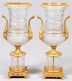 Lot#2072, D'ORE BRONZE AND CUT CRYSTAL STANDING PALACE URNS WITH HANDLES PAIR H 4' 8" DIA 17"13" x 13" base. Various designs throughout crystal. Mid  to late 20th century.