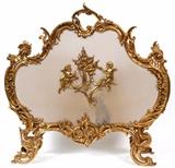 Lot#2253, FRENCH D'ORE BRONZE FIRESCREEN, H 28", L 29", D 9"Depicting two putto tending to a fire at the center of the screen.  With a surrounding acanthus leaf border.