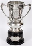 Lot#2279, SILVER PLATE DOUBLE HANDLE CLEVELAND ATHLETIC CLUB TROPHY, 1911, H 18", W 13", DIA CA. 8"For the track and field meet, June 10, 1911; raised garland; wood base; no maker's mark.