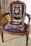 Louis XVI style armchair with needlepoint upholstery. Late 19th century. Walnut frame. Needlepoint in very good condition