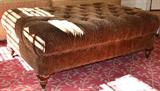 Large tufted ottoman with animal print upholstery  Perfect size for coffee table