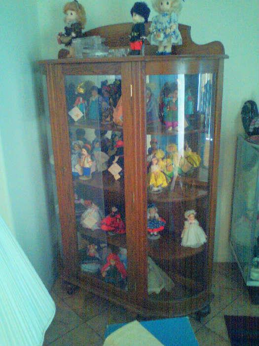 Bow Front China Cabinet with Madame Alexander Dolls