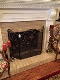 Black firescreen flanked by lovely floral/fruit arm chairs