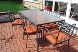 Glass topped wrought iron patio set