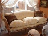 18th Century French settee with down cushions from Carlton Varney's showroom.
