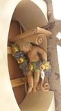 One of a pair of large sconces of cherubs with della robia garland, vintage.