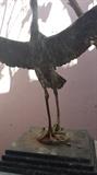 Metal casting of a bird about to take flight on marble base with 36" plinth not shown in photo.