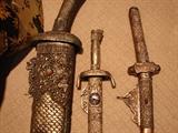 Hilts of three of the four swords