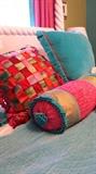 Colorful turquoise quilt and pillow combo makes you smile