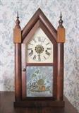 Antique Waterbury Clock Company steeple clock with reverse painted glass tablet